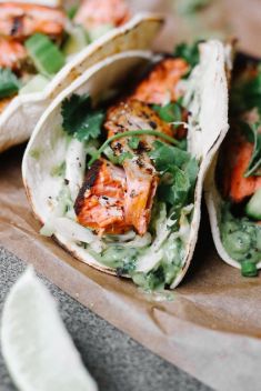 Blackened Salmon Tacos with Avocado Cilantro Sauce and Cabbage Slaw - 30 Best Fish Tacos That Will Change Your Mind Of Fish